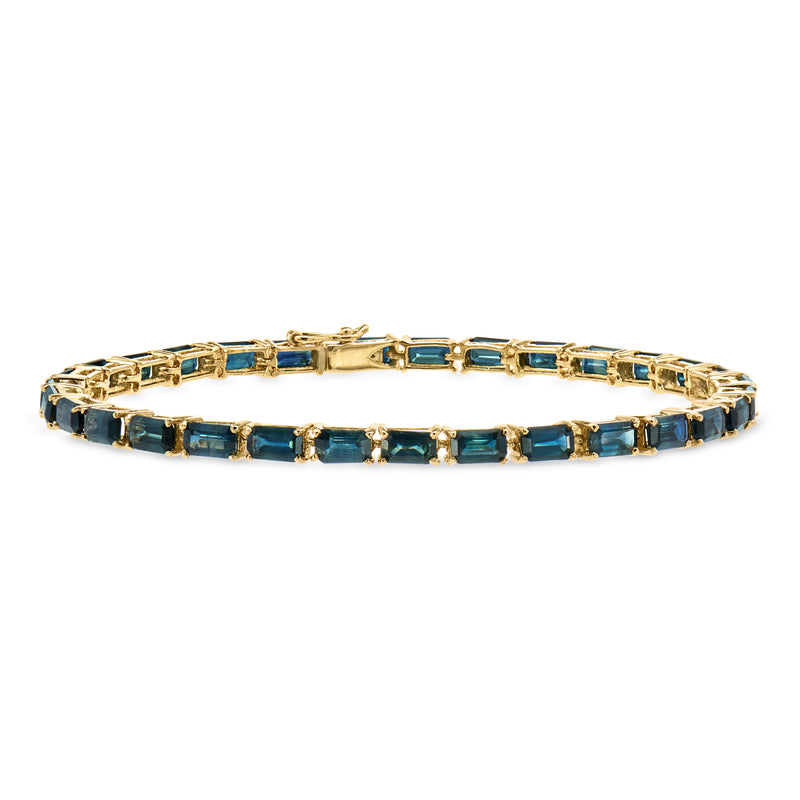 Gold sapphire tennis bracelet with rectangular blue gemstone links