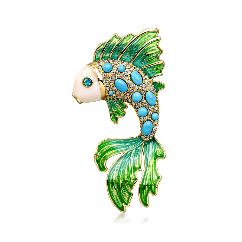 Fish pin in gold-tone with green enamel fins and blue simulated gemstones