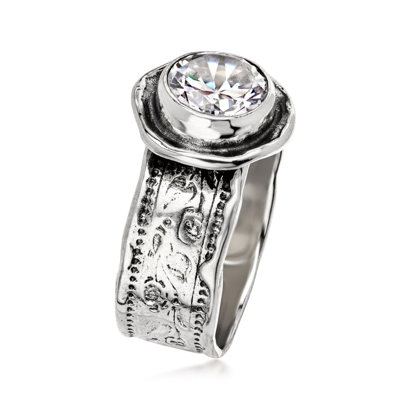 Sterling silver CZ ring with round center stone in raised bezel and textured band