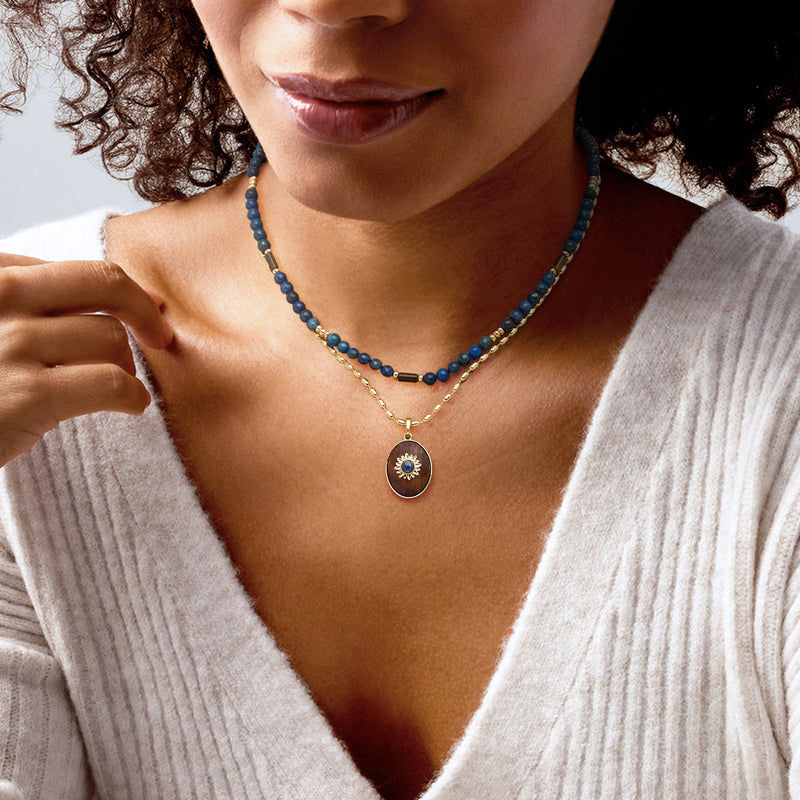 Gold-plated necklace set with blue bead choker and round pendant charm