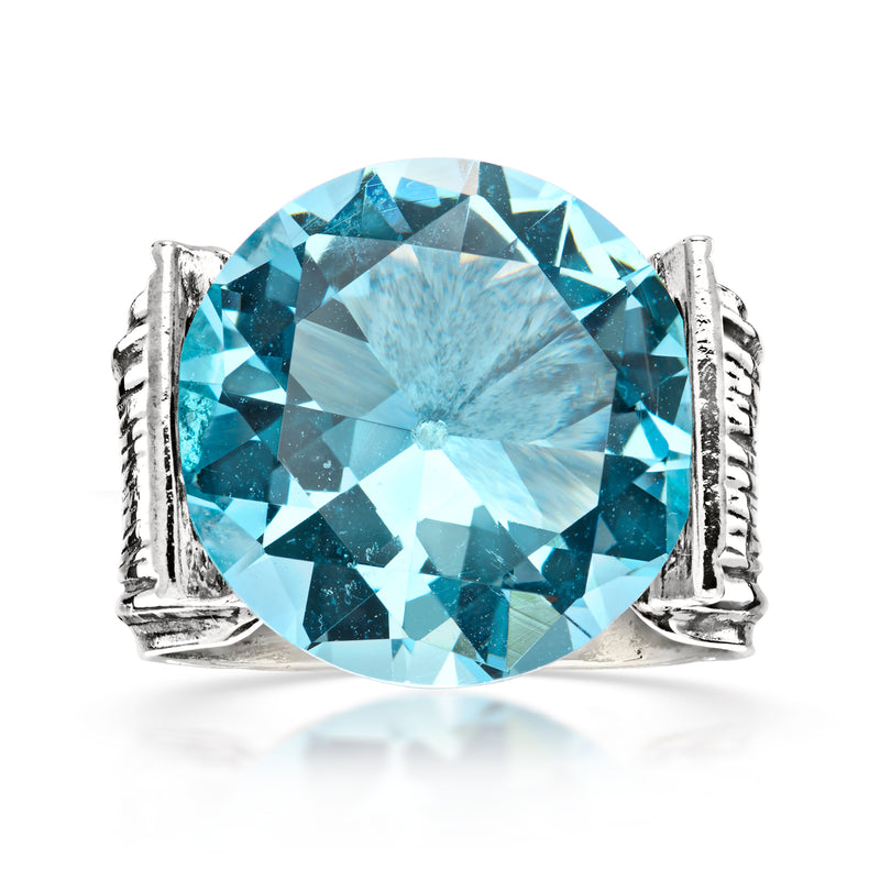 Vintage sterling silver ring with large oval simulated blue topaz and split prongs