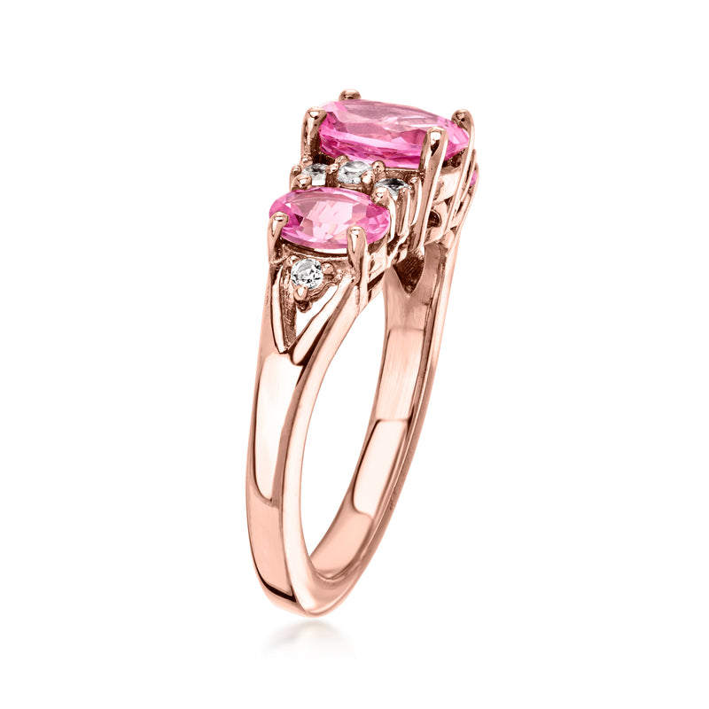 Rose gold ring with pink emerald-cut center CZ and side pink stone detailing