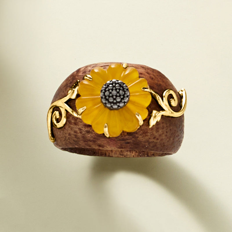 Sunflower ring featuring yellow petals and dark beaded center set in goldtone claws