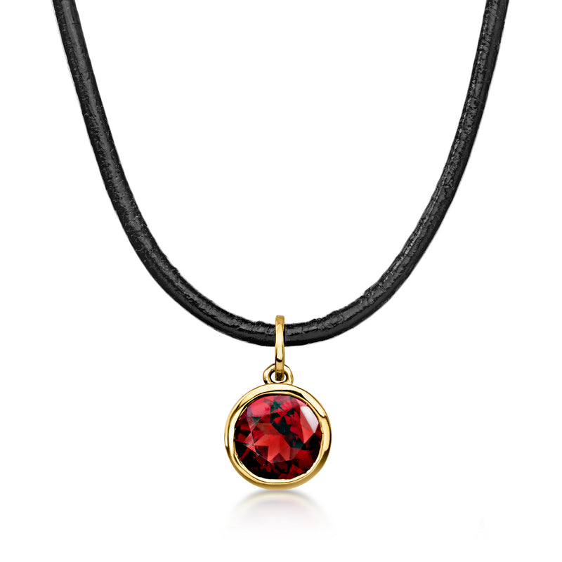 Garnet pendant necklace with black leather cord and 18kt gold bezel setting