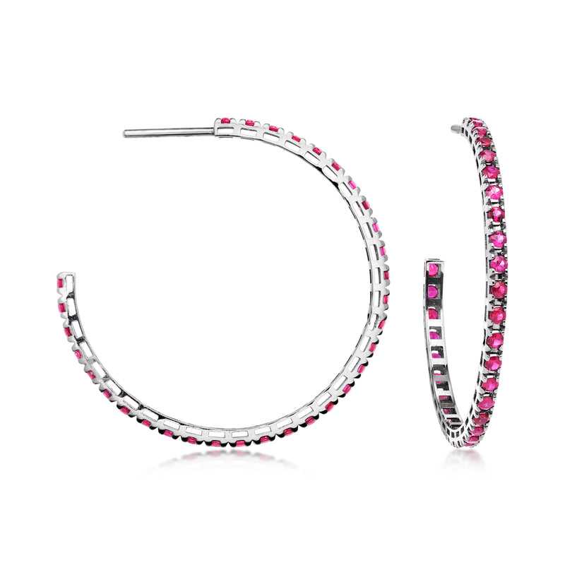 White gold hoop earrings with pink ruby gemstones in channel setting, hinged hoop