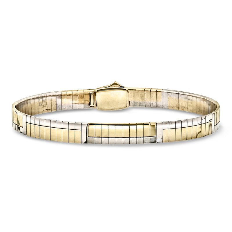 Two-tone 14kt gold omega bracelet with hinged clasp and ribbed link panels