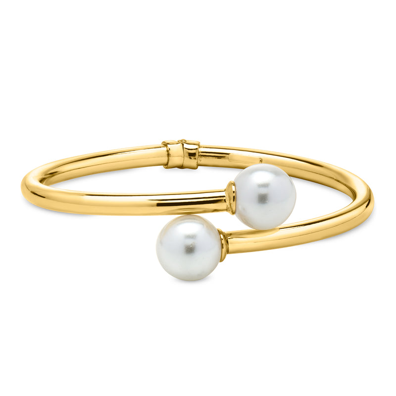 Yellow gold-plated bypass bracelet with two white simulated pearl accents