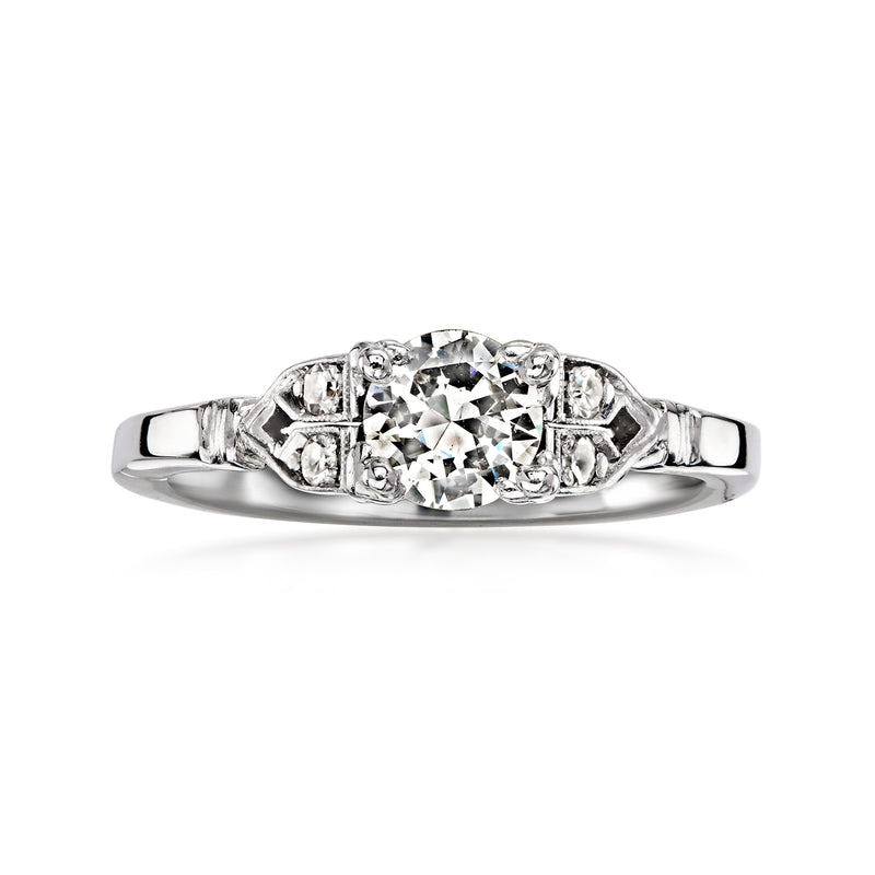 Vintage diamond ring with oval center stone and side accents, 14kt white gold band
