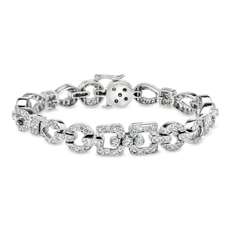 18kt white gold diamond link bracelet with alternating square and round diamond settings