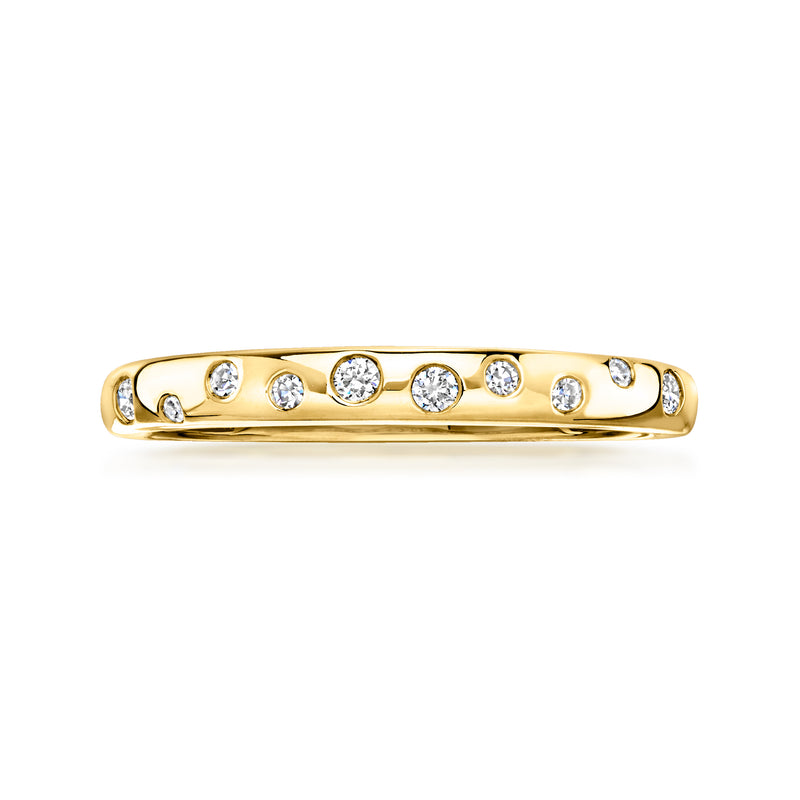 Gold diamond band ring with scattered round stones across the top