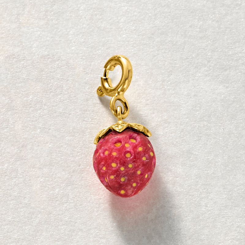 Gold strawberry charm pendant with red enamel and yellow spot detail