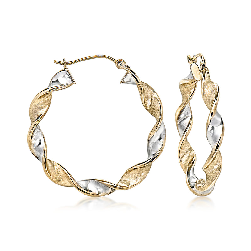 Two-tone twisted hoop earrings with ridged gold and silver loops, clasp detail