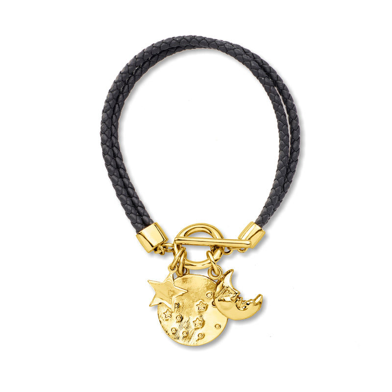 Braided black leather bracelet with gold toggle clasp and moon-and-star charm