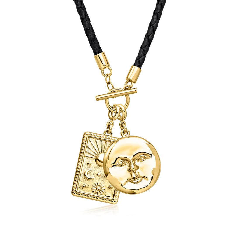 Black leather cord necklace with two gold celestial charms: sun star square and moon face