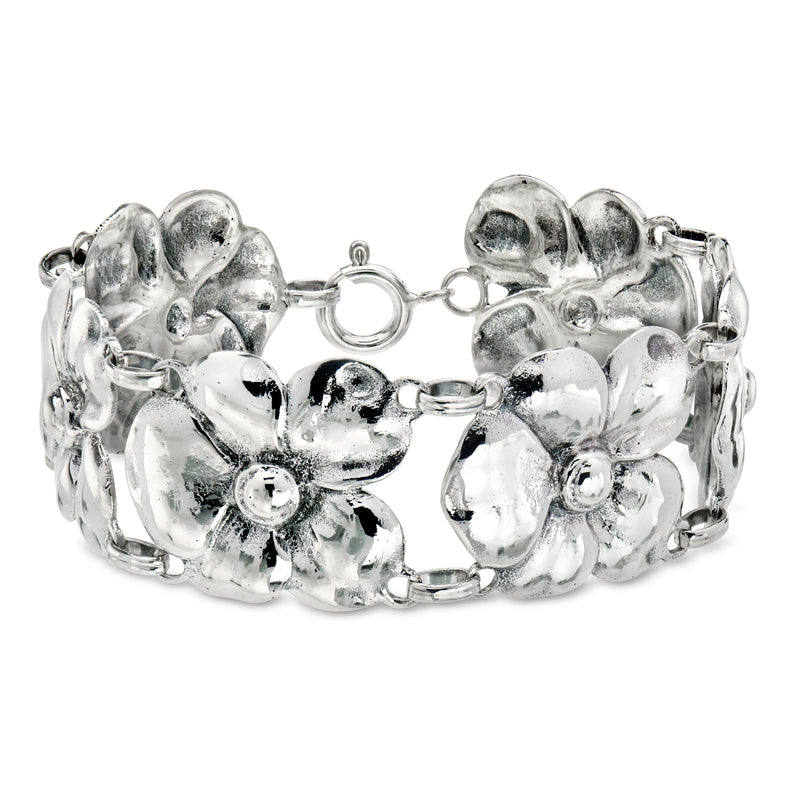 Vintage sterling silver flower link bracelet with round toggle clasp, shiny floral links