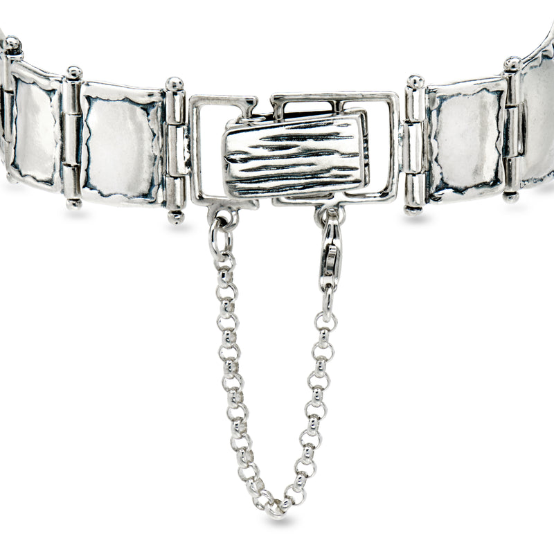 Sterling silver wide link bracelet with rectangular clasp and dangling chain accents