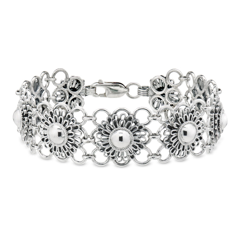 Sterling silver flower-link bracelet with scalloped floral medallions and clasp