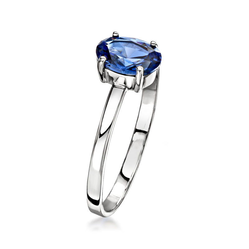 10kt white gold ring with oval blue sapphire in four-prong basket setting