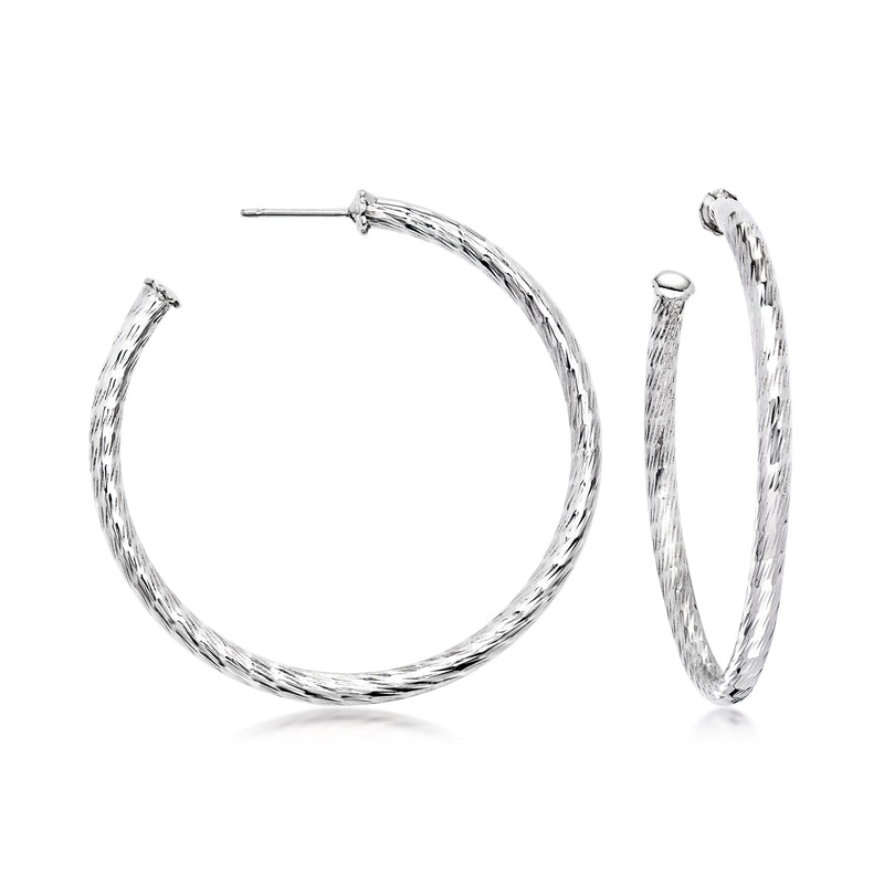 Sterling silver vintage hoop earrings with textured swirl finish and clasp.