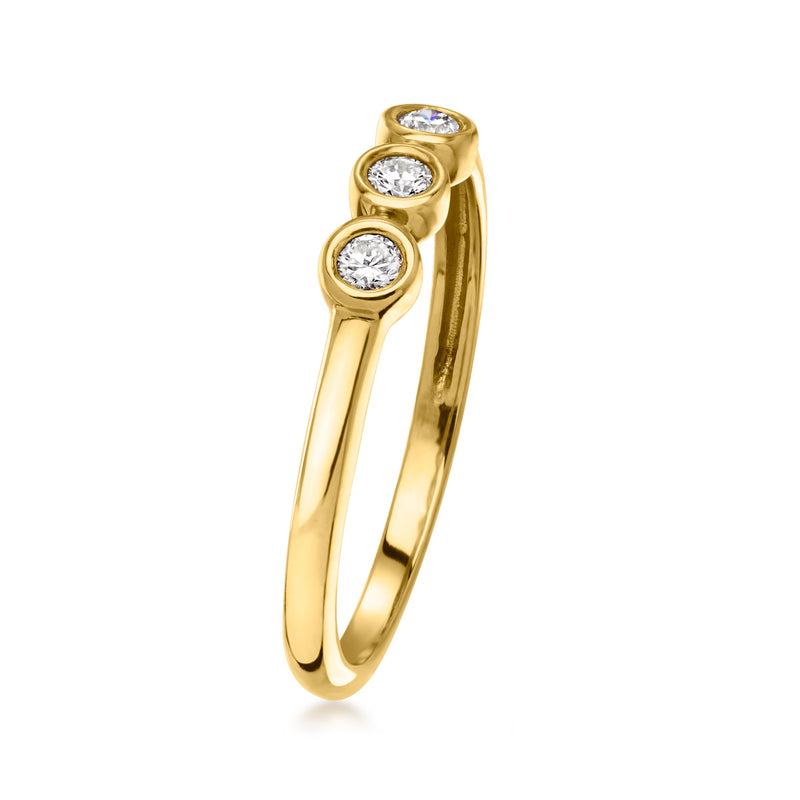 Yellow gold three-stone ring with visible round bezel-set diamonds, curved shank