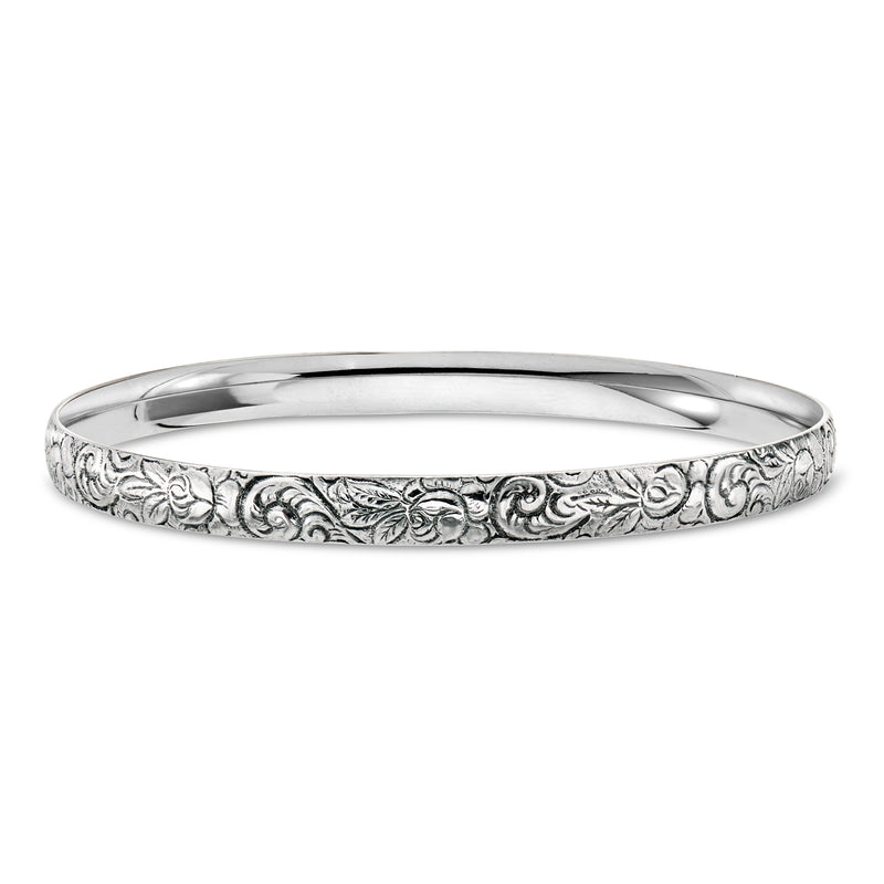 Vintage sterling silver engraved bangle with floral scroll pattern