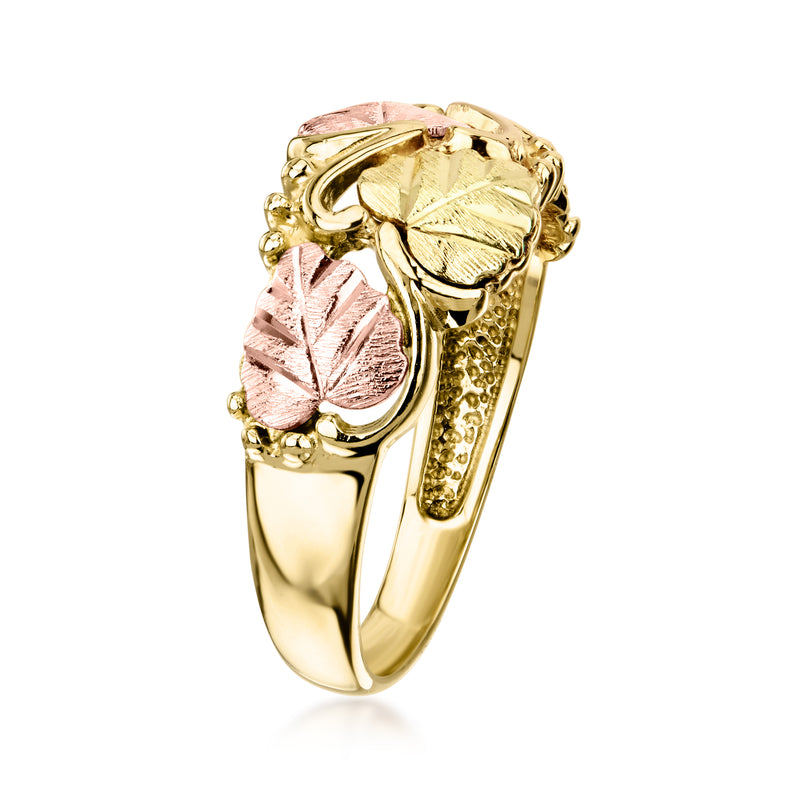 Two-tone leaf ring in gold with pink rose leaf accents and textured edge