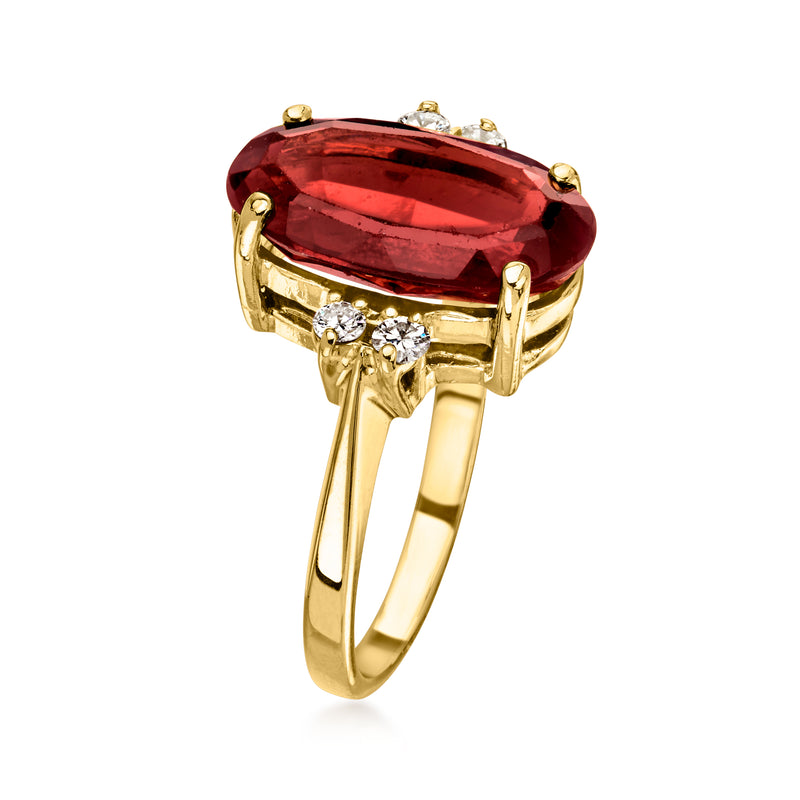 14kt yellow gold ring with large oval red garnet center and surrounding diamonds