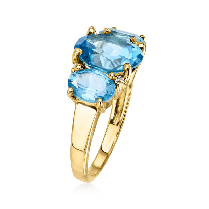 Vintage yellow gold ring with three blue oval stones, topaz center and diamond prongs