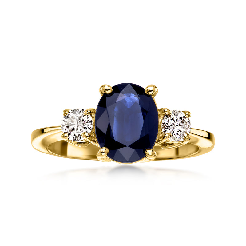 Vintage oval sapphire and diamond ring in 14kt yellow gold with halo-style side stones