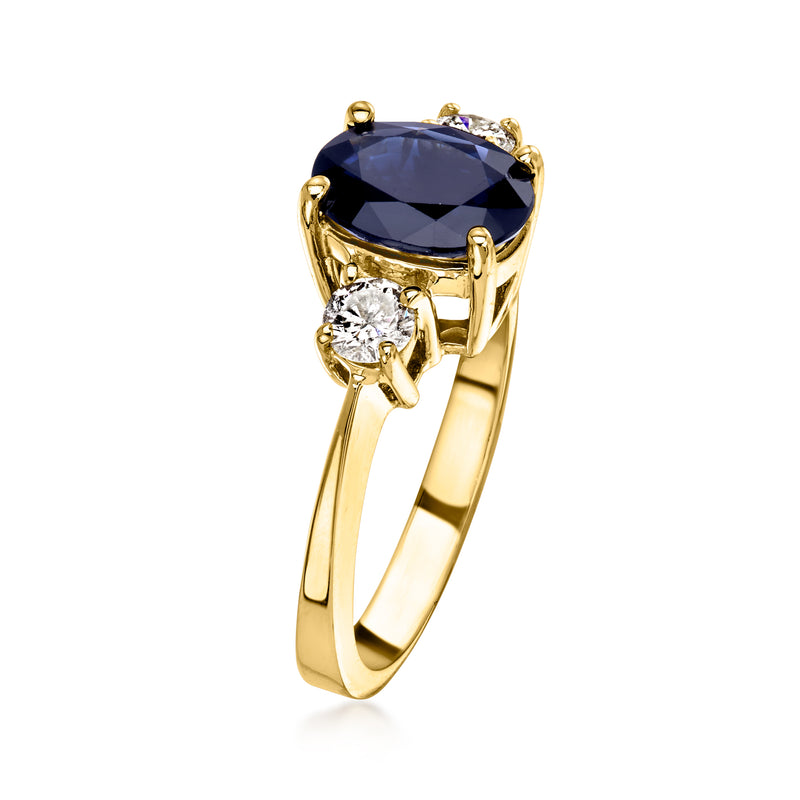 Oval blue sapphire ring in 14kt yellow gold with round diamonds on the shoulders