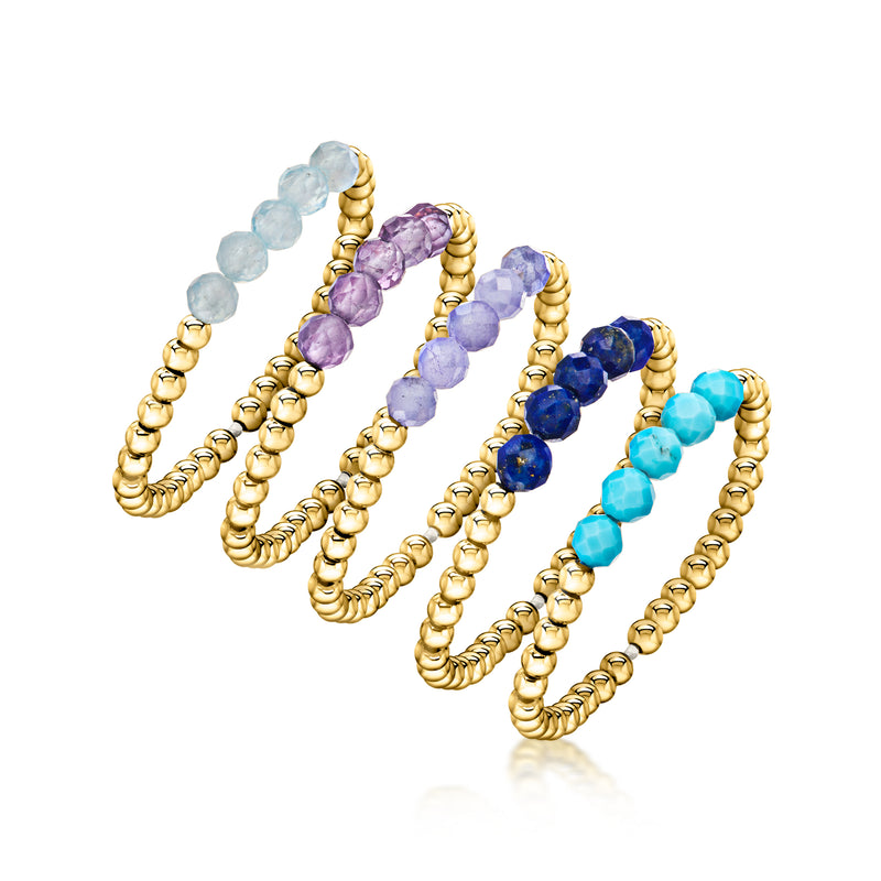 Five gold-plated bead stretch rings with light blue, purple, dark blue, and turquoise beads