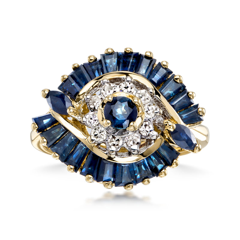 Vintage sapphire and diamond swirl ring in 14kt yellow gold, blue oval center, halo