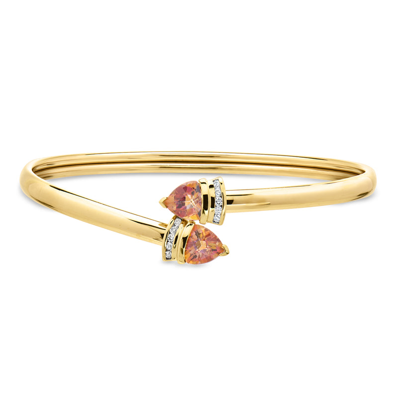10kt yellow gold bypass bracelet with pear-cut pink topaz and small diamond accents