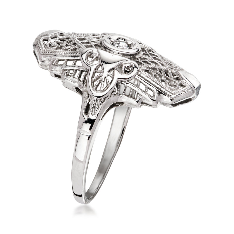 White gold diamond filigree ring with sculpted side setting and prong detail