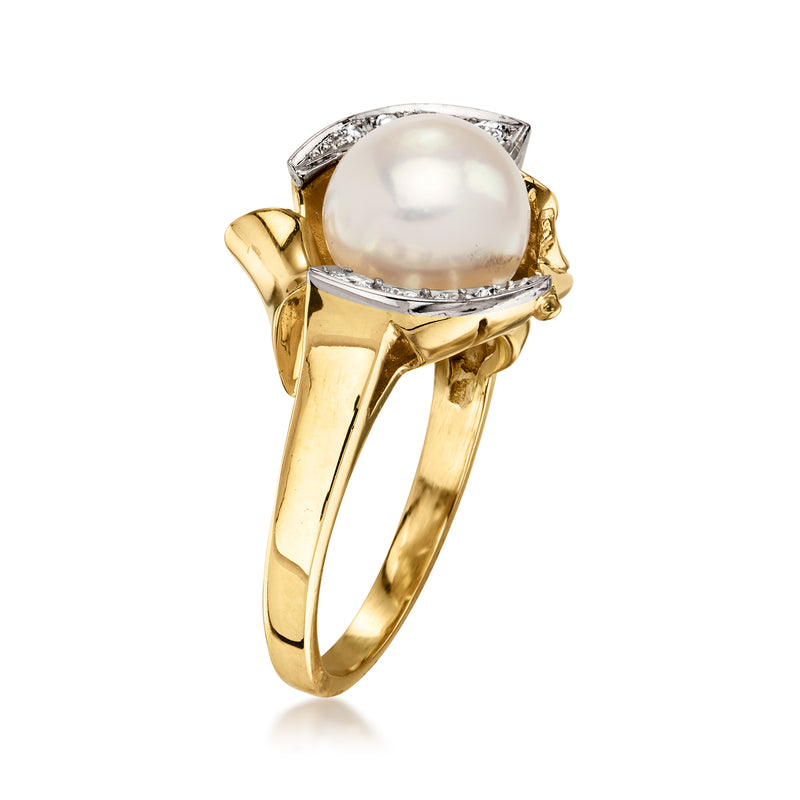 Vintage cultured pearl ring in 14kt yellow gold with diamond side accents and halo