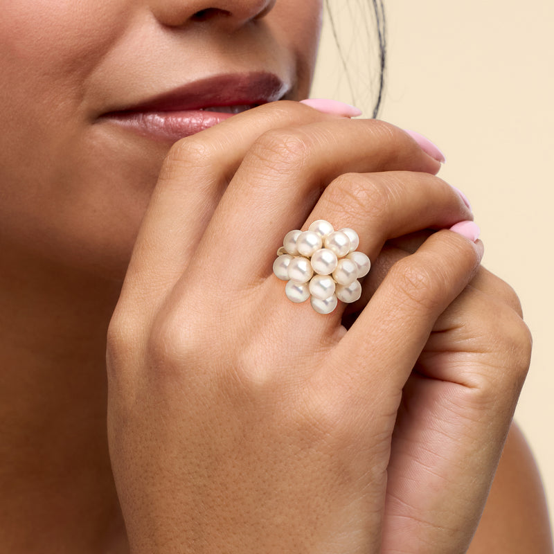 White pearl cluster ring on yellow gold band with stacked round pearls