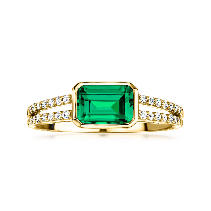 10kt yellow gold ring with emerald-cut green gemstone and diamond band