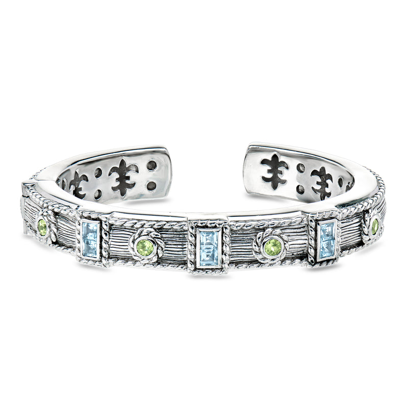 Sterling silver cuff bracelet with sky blue and peridot gemstone panels, hinged design