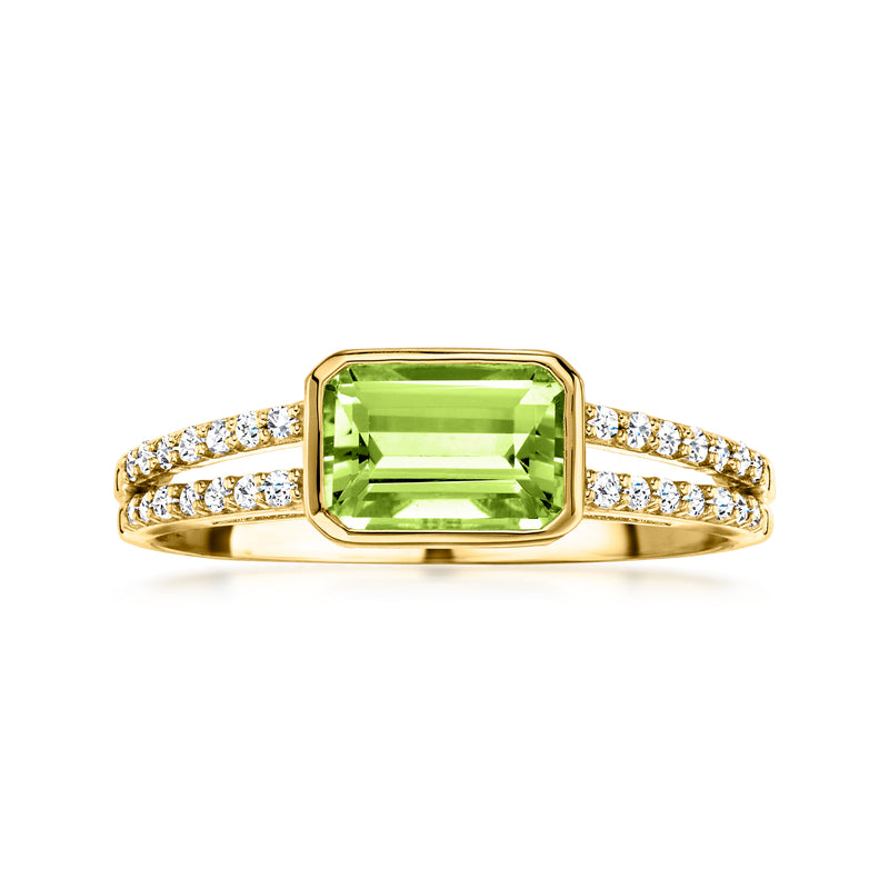 Yellow gold ring with emerald-cut peridot and diamond accents