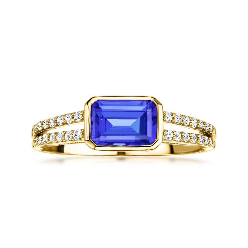 Yellow gold ring with blue sapphire and diamond accents in rectangular halo setting