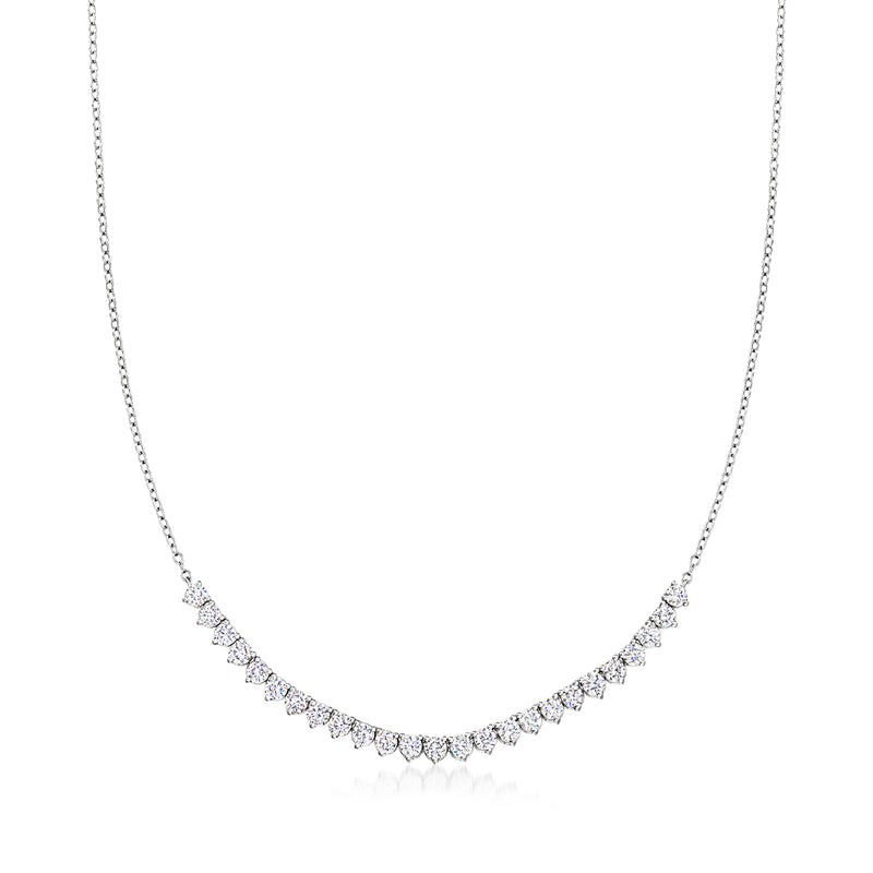 Sterling silver tennis-style diamond necklace with small bezel-set stones in curved row