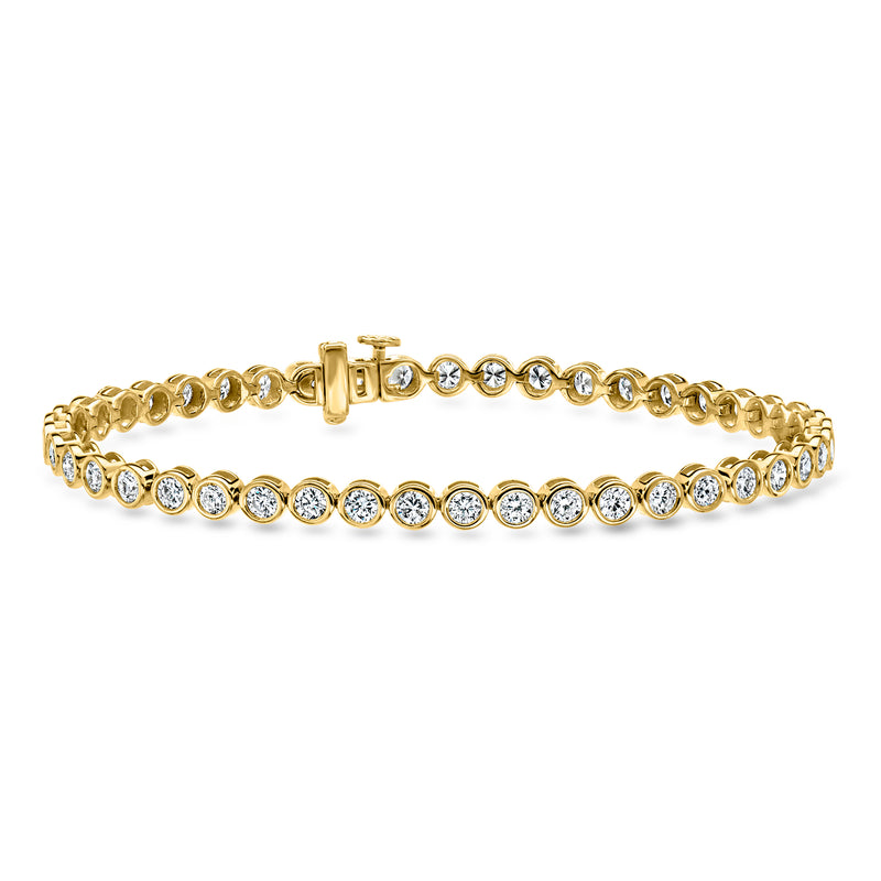 Gold tennis bracelet with bezel-set round diamonds in a continuous row