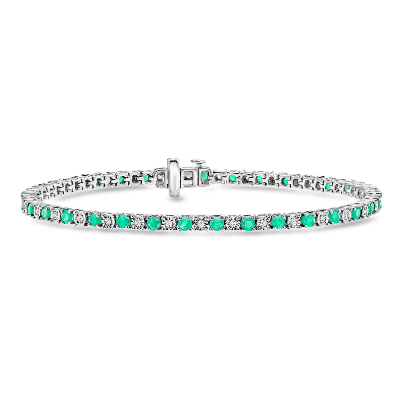 Emerald tennis bracelet in sterling silver with green oval stones and diamond accents