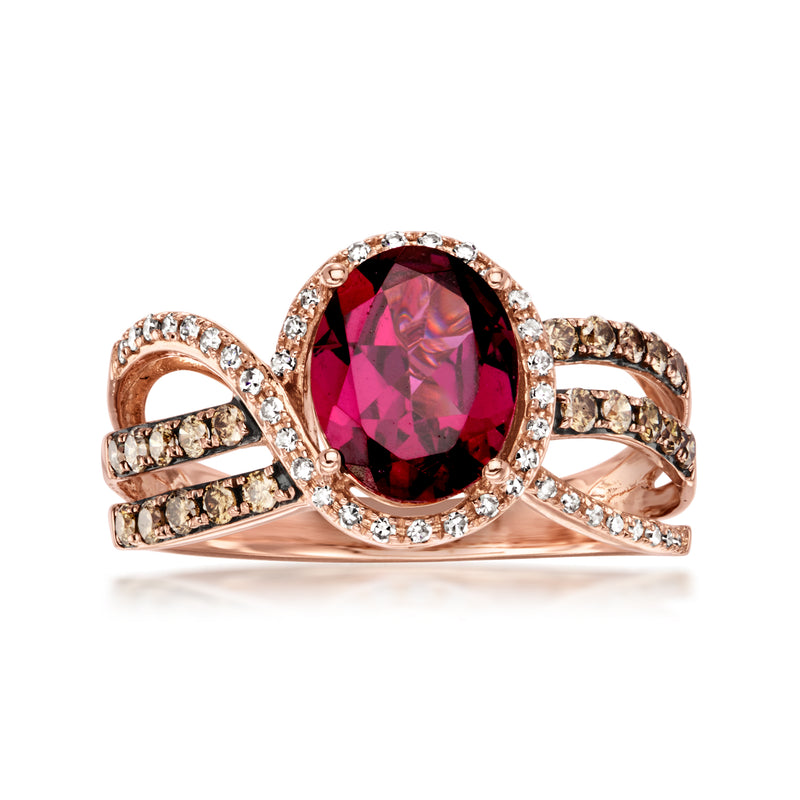 Rose gold vintage gemstone ring with oval rhodolite garnet and diamond halo accents