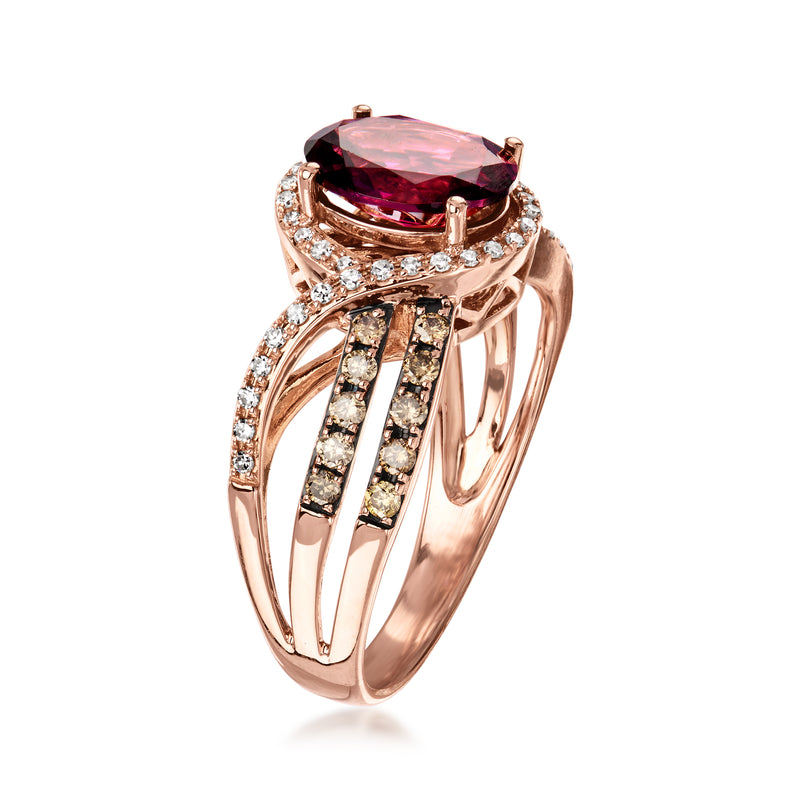 Rose gold vintage ring with large rhodolite garnet in prongs and diamond side rows