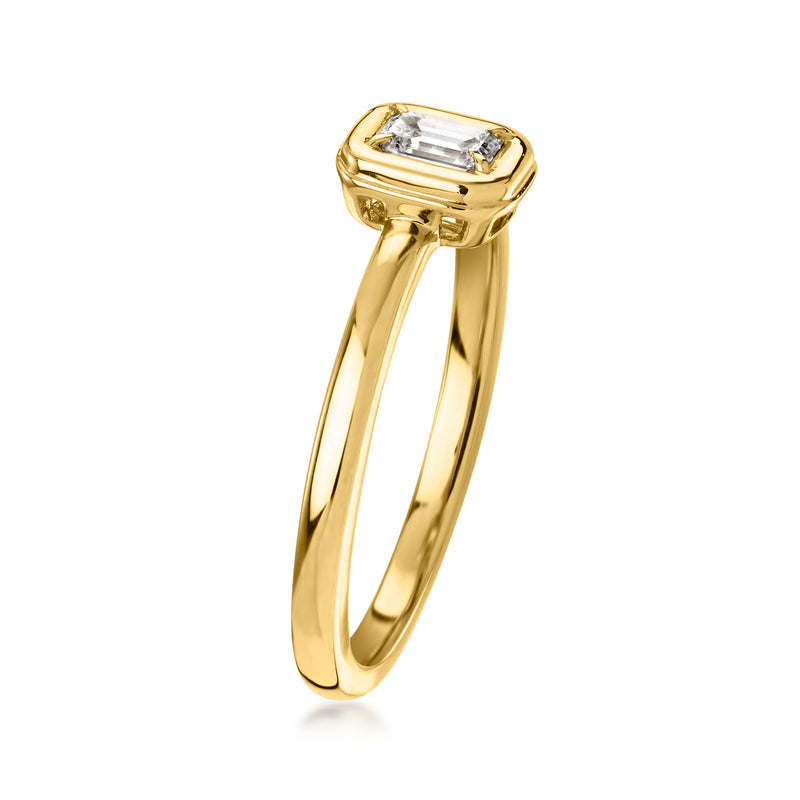 10k yellow gold ring with rectangular bezel-set emerald-cut diamond, side view
