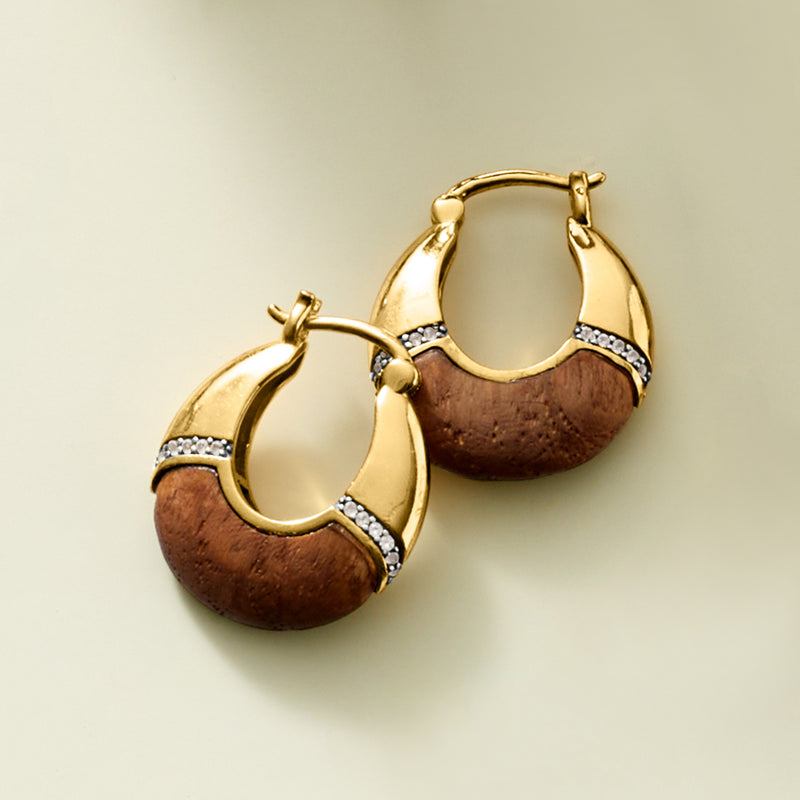Gold hoop earrings with brown wood insets and sparkling clear stone trim
