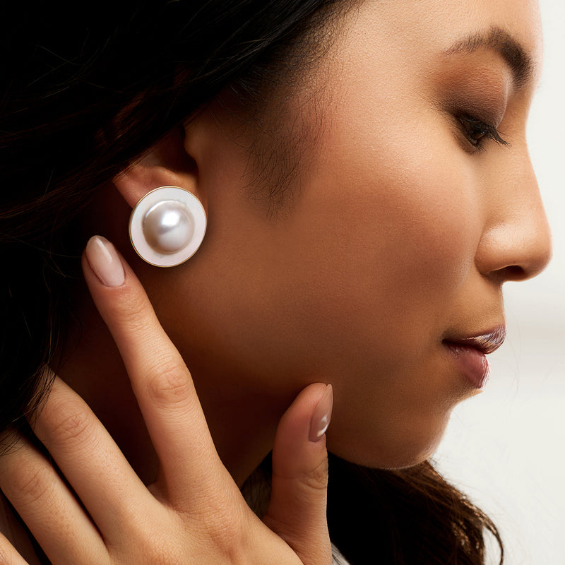 White blister pearl stud earring in 14kt yellow gold on model's ear