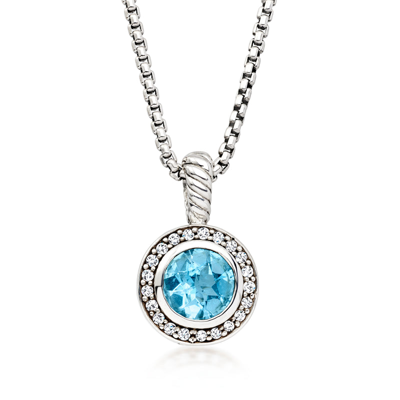 Sterling silver pendant necklace with oval blue topaz and diamond halo, link chain