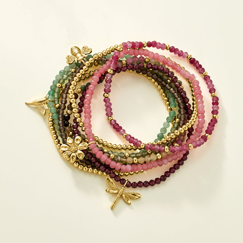 Layered bead stretch bracelets with gold-tone starfish and fish charms on multicolor beads